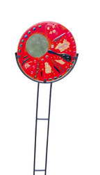 Decorative garden stake with a red circular design on a white background